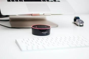 Amazon Echo Dot on a computer desk